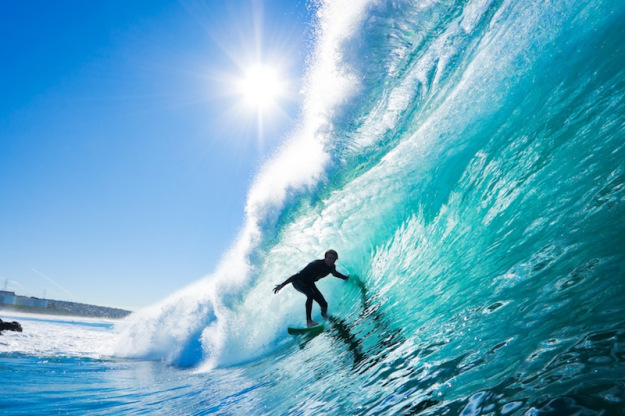 Surfer On Blue Ocean Wave